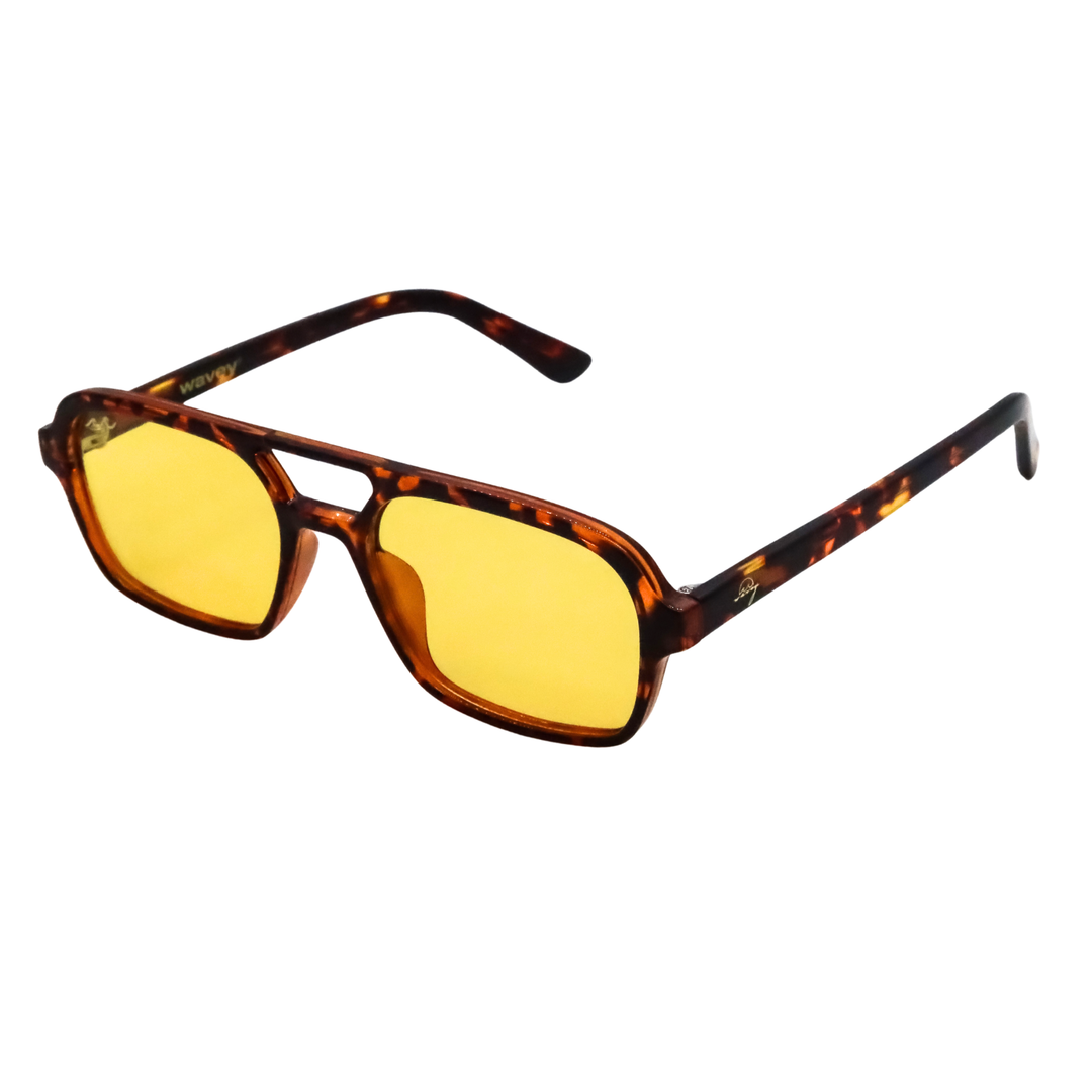 A pair of square aviator-style sunglasses with a translucent tortoiseshell frame and yellow tinted lenses, shown on a plain white background.