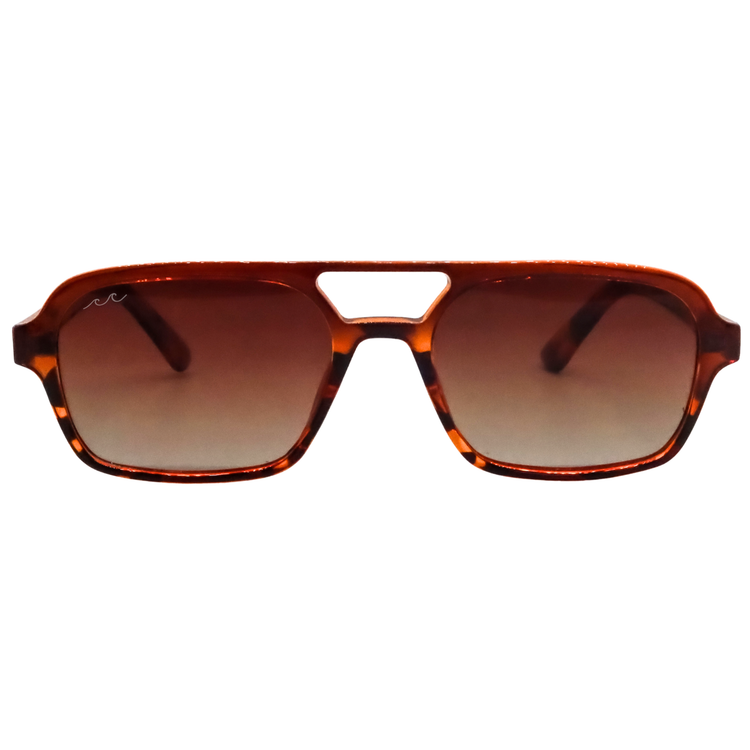 A pair of square aviator-style sunglasses with a translucent amber-brown tortoiseshell frame and gradient brown lenses, shown against a plain white background.