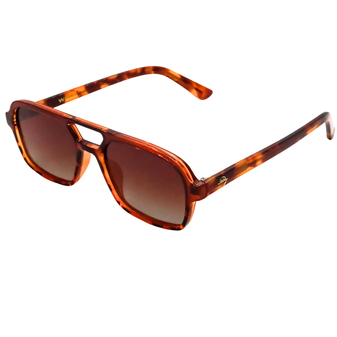 A pair of aviator-style sunglasses with a translucent tortoiseshell frame and gradient brown lenses, shown on a plain white background.